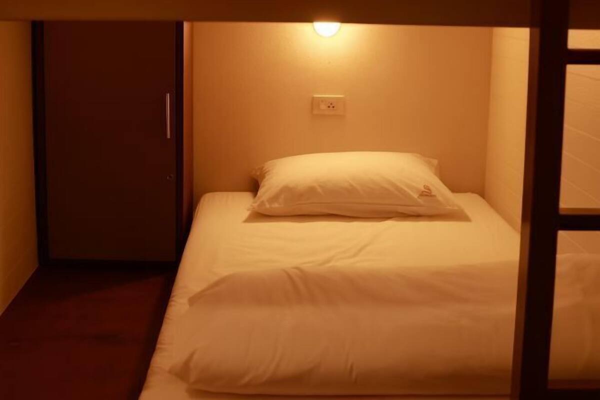 Premium bedding, desk, laptop workspace, soundproofing