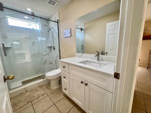 Shower, hair dryer, towels