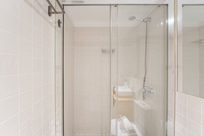 Shower, hair dryer, towels, soap
