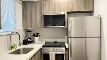 Fridge, coffee/tea maker, cookware/dishes/utensils