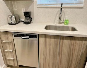 Fridge, coffee/tea maker, cookware/dishes/utensils