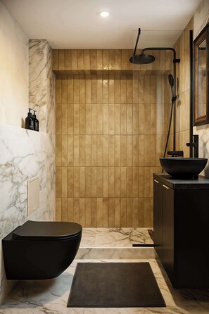 Shower, hair dryer, towels, shampoo