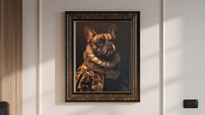 A bedroom with a bed, pillows, a framed artwork of a dog, and a wall-mounted light switch.