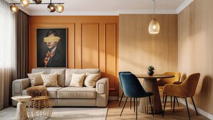 A modern living room with a sofa, a coffee table, and a dining area with chairs. - Qult·co - Huxley (București)