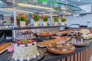 A buffet counter with various desserts and pastries. - Dream Of Ã–lÃ¼deniz - All inclusive (Fethiye)
