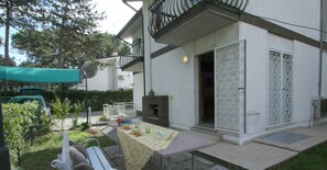Enjoy al fresco dining on the patio, where a barbecue grill and comfortable seating area await.