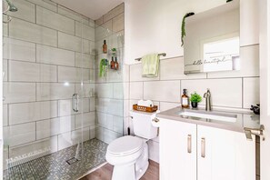 Shower, eco-friendly toiletries, hair dryer, towels