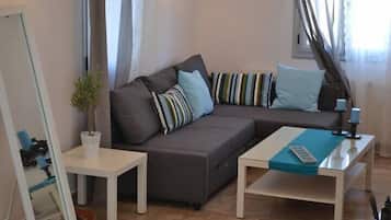 Family Suite, Pool View, Sea Facing | Living area | Flat-screen TV