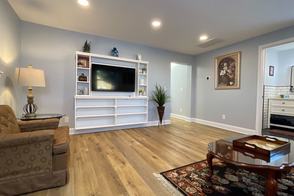 Relax in this stylish living room with a comfy sofa, Smart TV, modern design, and fast WiFi for all your entertainment needs!