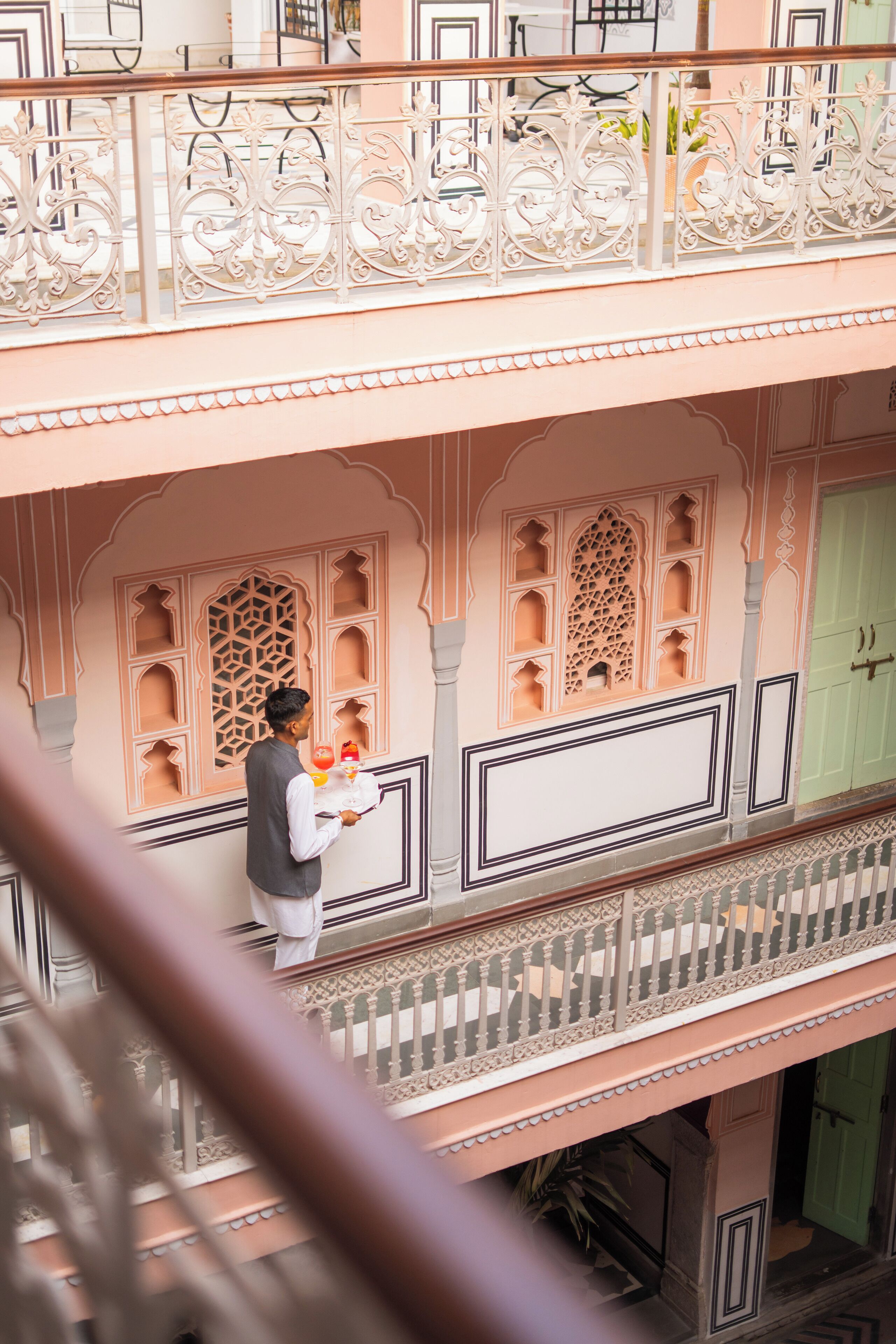 A multi-level building with ornate balconies and intricate architectural details.