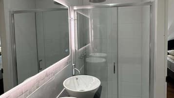 Shower, hair dryer, towels, shampoo