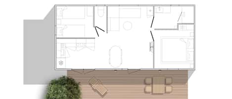 A top-down floor plan of a house with a living room, kitchen, two bedrooms, a bathroom, and a small outdoor seating area with a tree.