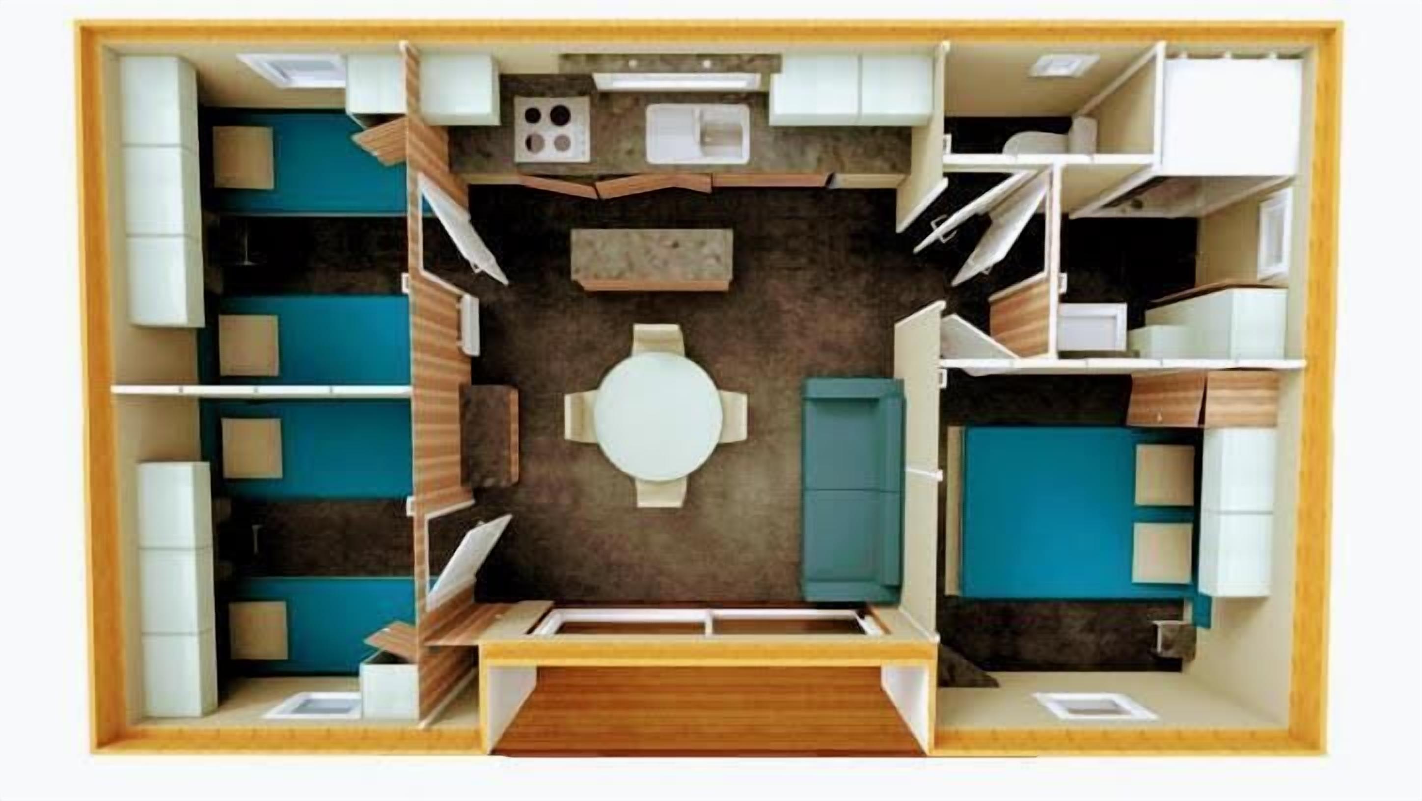 Un plan d’étage d’une chambre d’hôtel comprenant une table à manger, un coin cuisine, une salle de bain et un espace de vie.