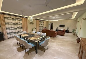 Elite Suite, Garden View | Living area | 40-inch Smart TV with digital channels - The Serene Shores - Luxury Private Villa (Vanur)