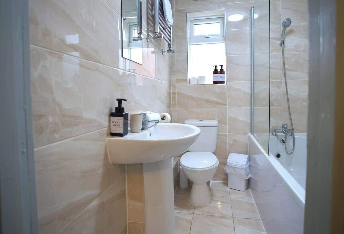 Shower, hair dryer, towels, shampoo
