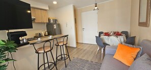Apartamento | Zona de estar | Una televisión de pantalla plana