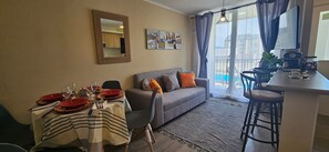 Apartment | Living area | Flat-screen TV - Oceana Suites Volcán Villarrica (Villarrica)