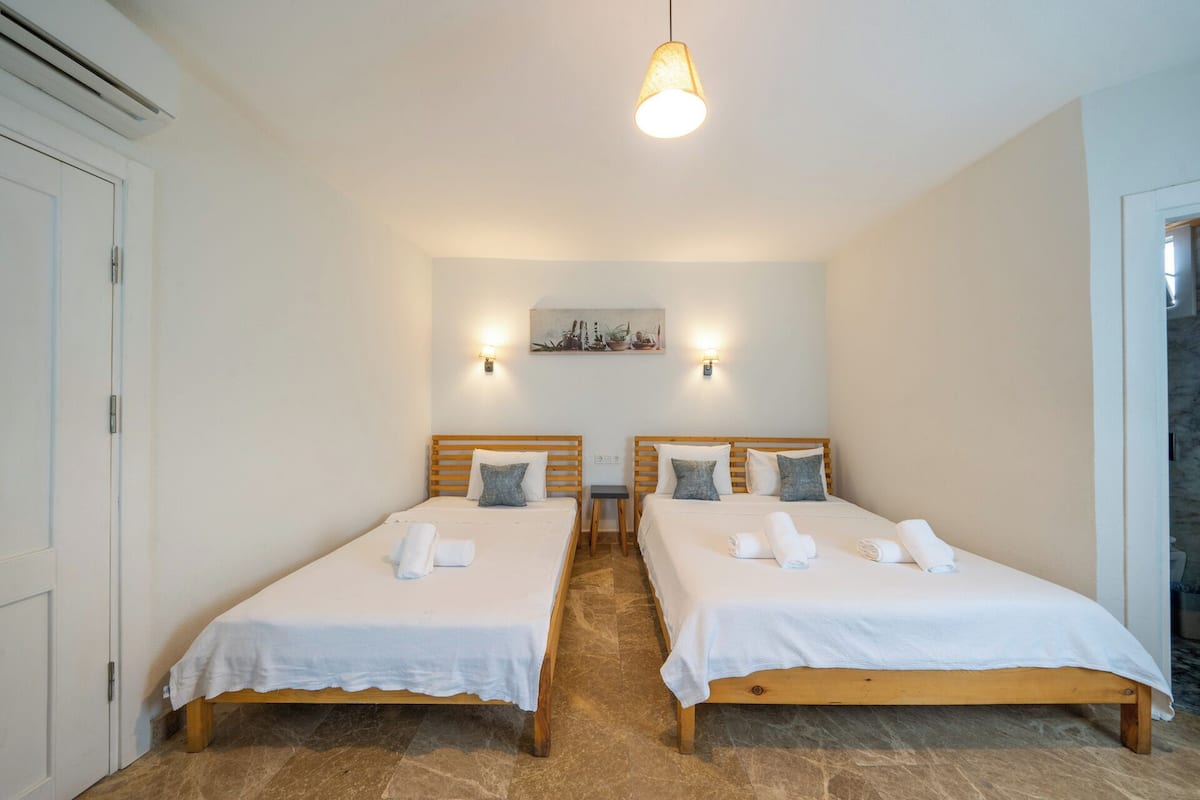Deluxe Triple Room, City View | In-room safe, blackout drapes, soundproofing, iron/ironing board