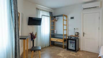 Deluxe Triple Room, City View | In-room safe, blackout drapes, soundproofing, iron/ironing board