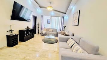 Deluxe Condo, 2 Bedrooms, Golf View | Living area | 43-inch flat-screen TV with digital channels