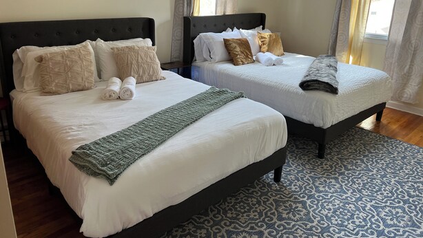 A hotel room with two beds, a patterned rug, and curtains on the windows. - Hidden Gem Quiet Dead-End St Near All Casino (Montville)