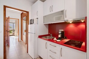 Fridge, microwave, stovetop, coffee/tea maker