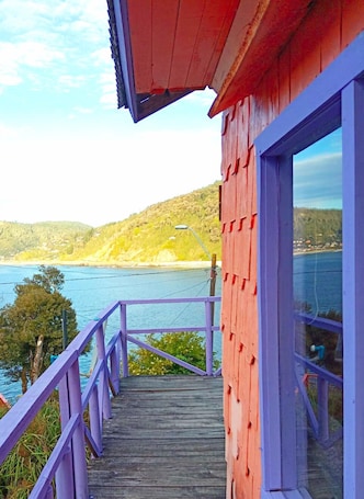 Property grounds. Cabaña Maicolpue Rio Sur has a large terrace with beautiful ocean view.