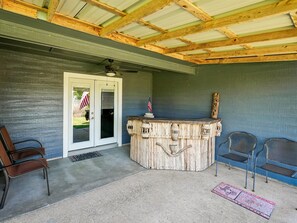 A covered outdoor area with a wooden ceiling, a bar counter, and seating. - Sorry Charlie's | Waterfront Serenity (Rockport)