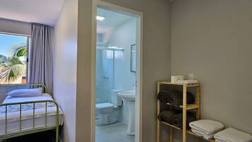 Family Suite | Bathroom | Shower, free toiletries, soap, toilet paper