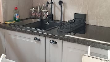 Fridge, microwave, stovetop, coffee/tea maker