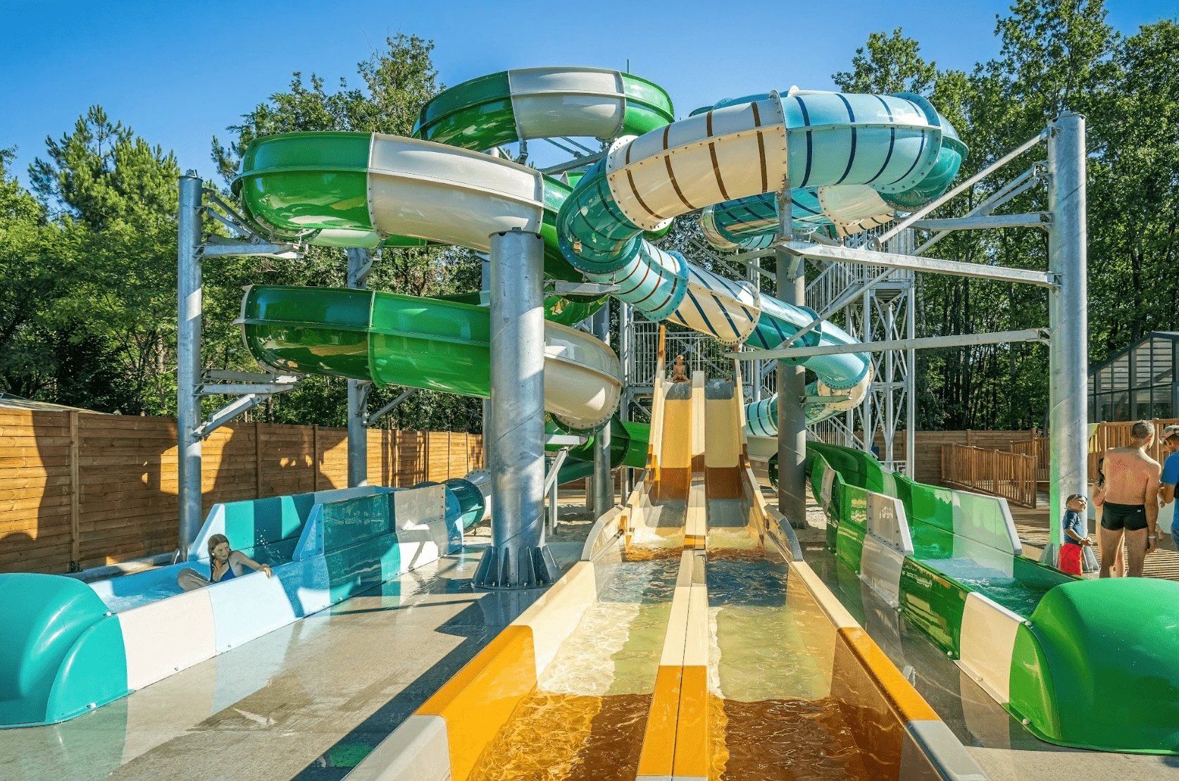 A water park with multiple slides and a pool area.