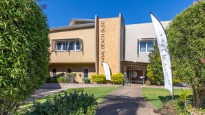 A building with a sign reading "FINGAL BEACH SLSC".