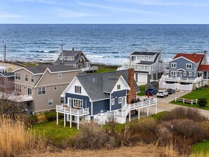 A coastal residential area with houses featuring balconies and a view of the ocean. - Coastal Dream Vacation Home at Moody Beach - Sleeps 8 (Wells)