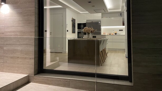 A modern kitchen with a central island, a refrigerator, and a microwave. - Luxury Home in Granada with Private Pool (AN)