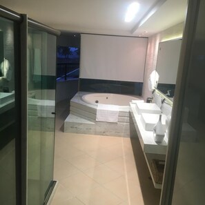 Shower, jetted bath, towels, soap