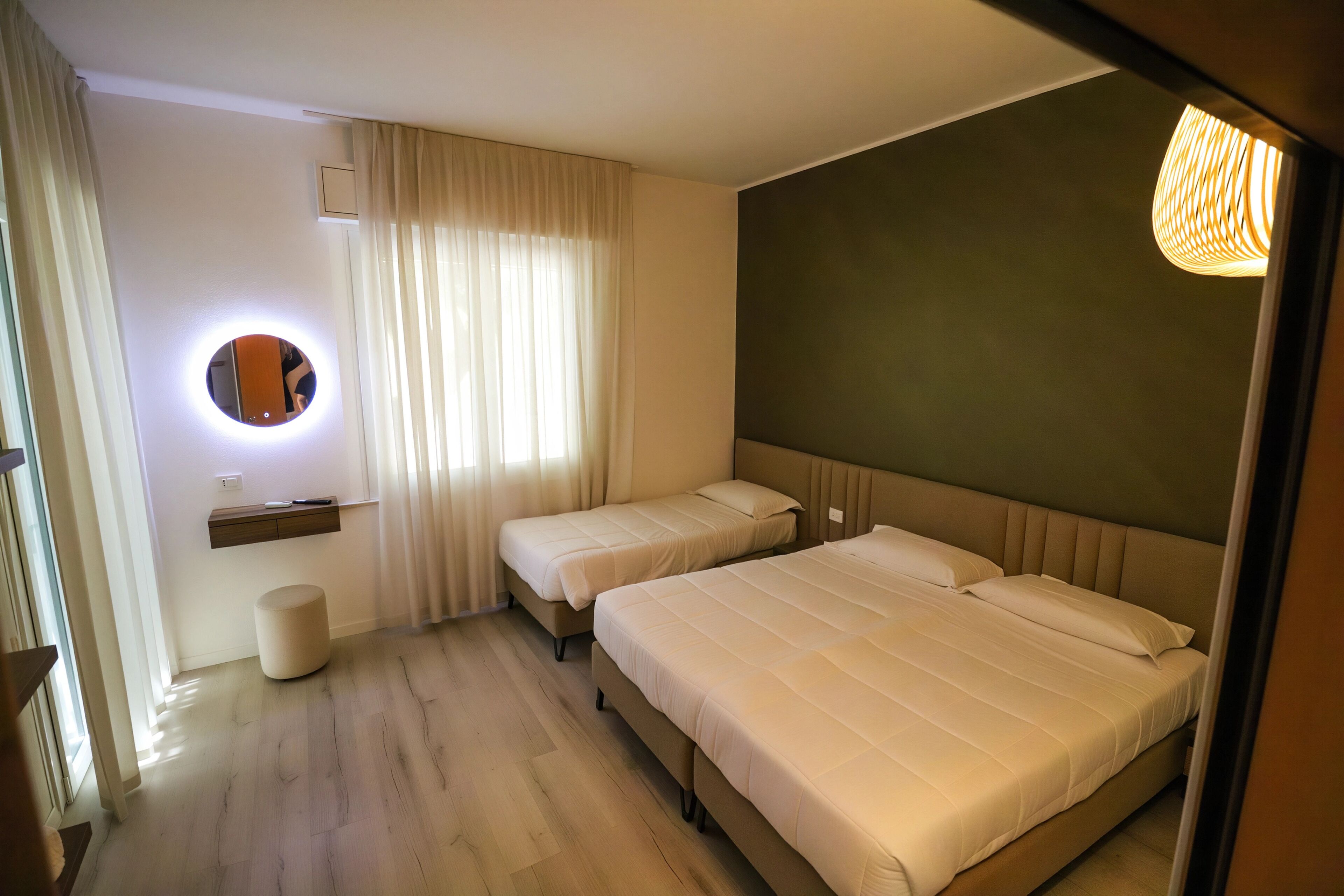 Deluxe Triple Room, 1 Bedroom, Non Smoking, Garden View | Desk, laptop workspace, blackout curtains, soundproofing
