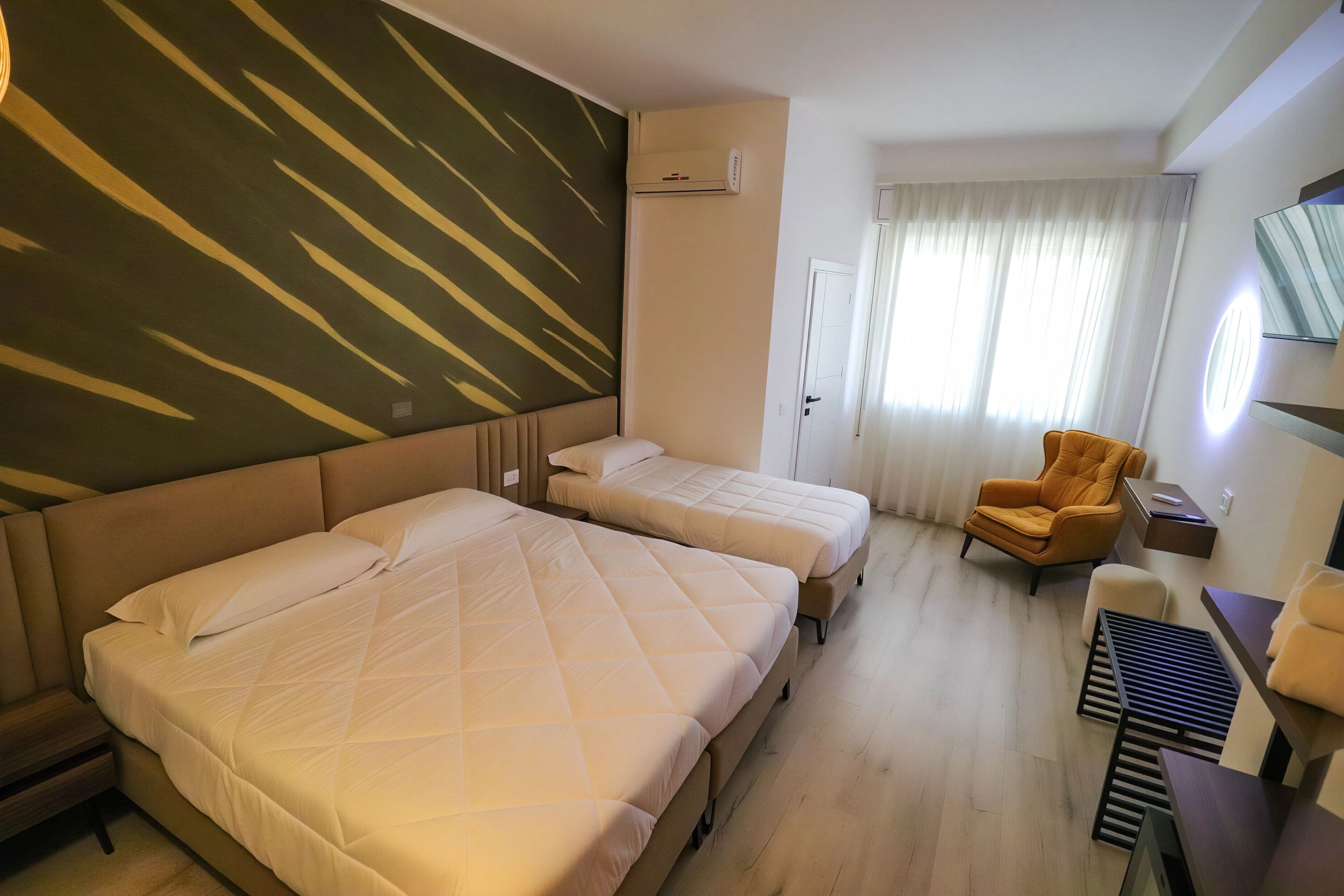 Deluxe Triple Room, 1 Bedroom, Non Smoking, Garden View | Desk, laptop workspace, blackout drapes, soundproofing