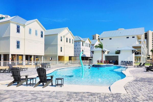 The Boathouse 4/3.5. Boat Slip Included! Stunning Zero Entry Pool.