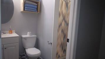 Shower, towels, soap, toilet paper