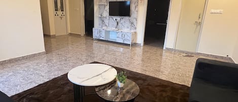 Apartment, 2 Bedrooms | Living area | 43-inch LED TV with digital channels, streaming services