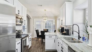 Coffee/tea maker, fridge, microwave, oven