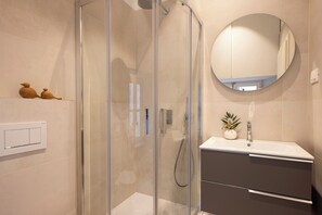 Shower, free toiletries, hair dryer, slippers