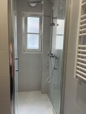 Shower, hair dryer, towels, soap