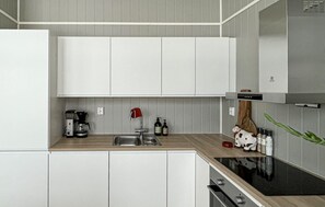 Fridge, dishwasher, coffee/tea maker, cookware/dishes/utensils
