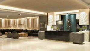 A modern living room with a sofa set, a coffee table, and a TV. - Live Just Steps Away From Mall of Asia (Pasay)