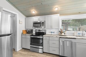 Coffee/tea maker, fridge, microwave, oven