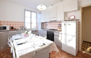 Fridge, stovetop, dishwasher, coffee/tea maker