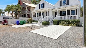 A two-story white building with a porch and a balcony. - Southern Skies, Stylish Home in Old Town Key West (Key West)
