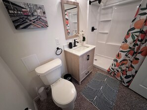 Shower, towels, soap, toilet paper
