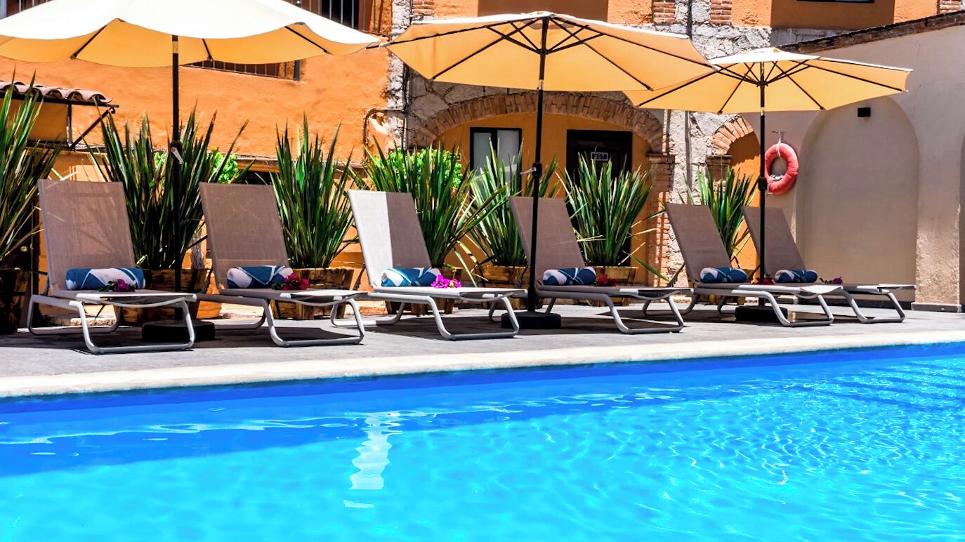 Outdoor pool, open 9:00 AM to 9:00 PM, pool umbrellas, sun loungers